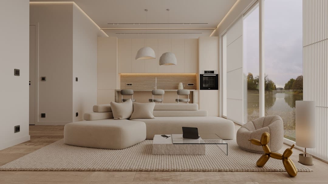 Decluttered minimalist living room with neutral tones and a single accent piece beside a large window