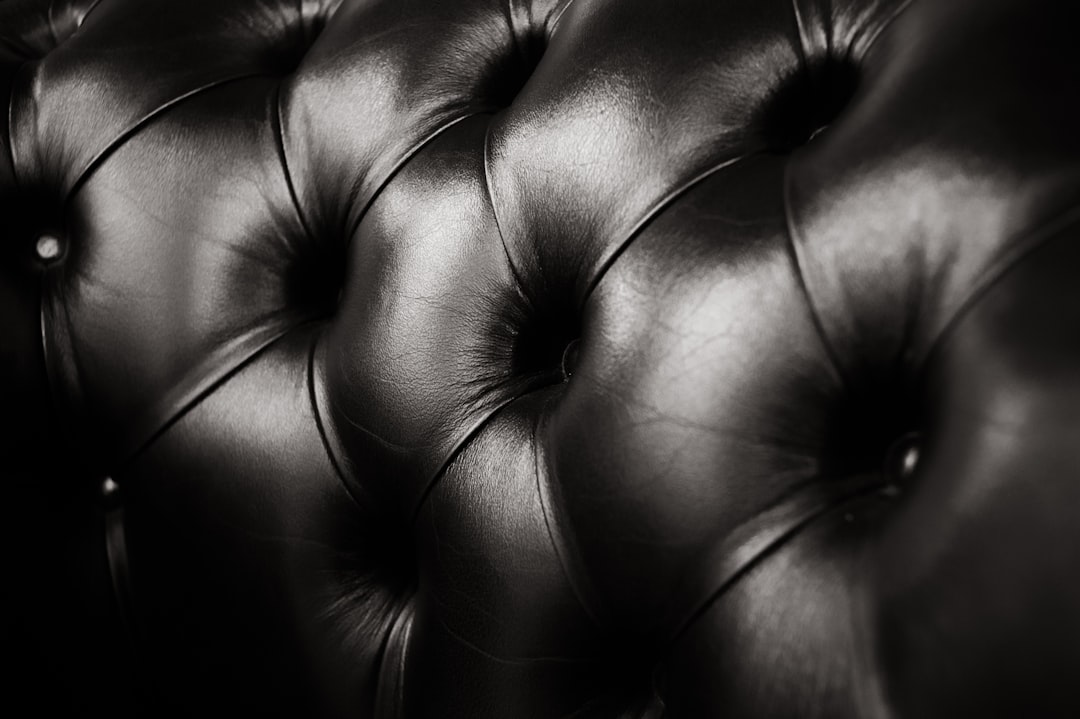 Detail view of leather texture and power recline mechanism